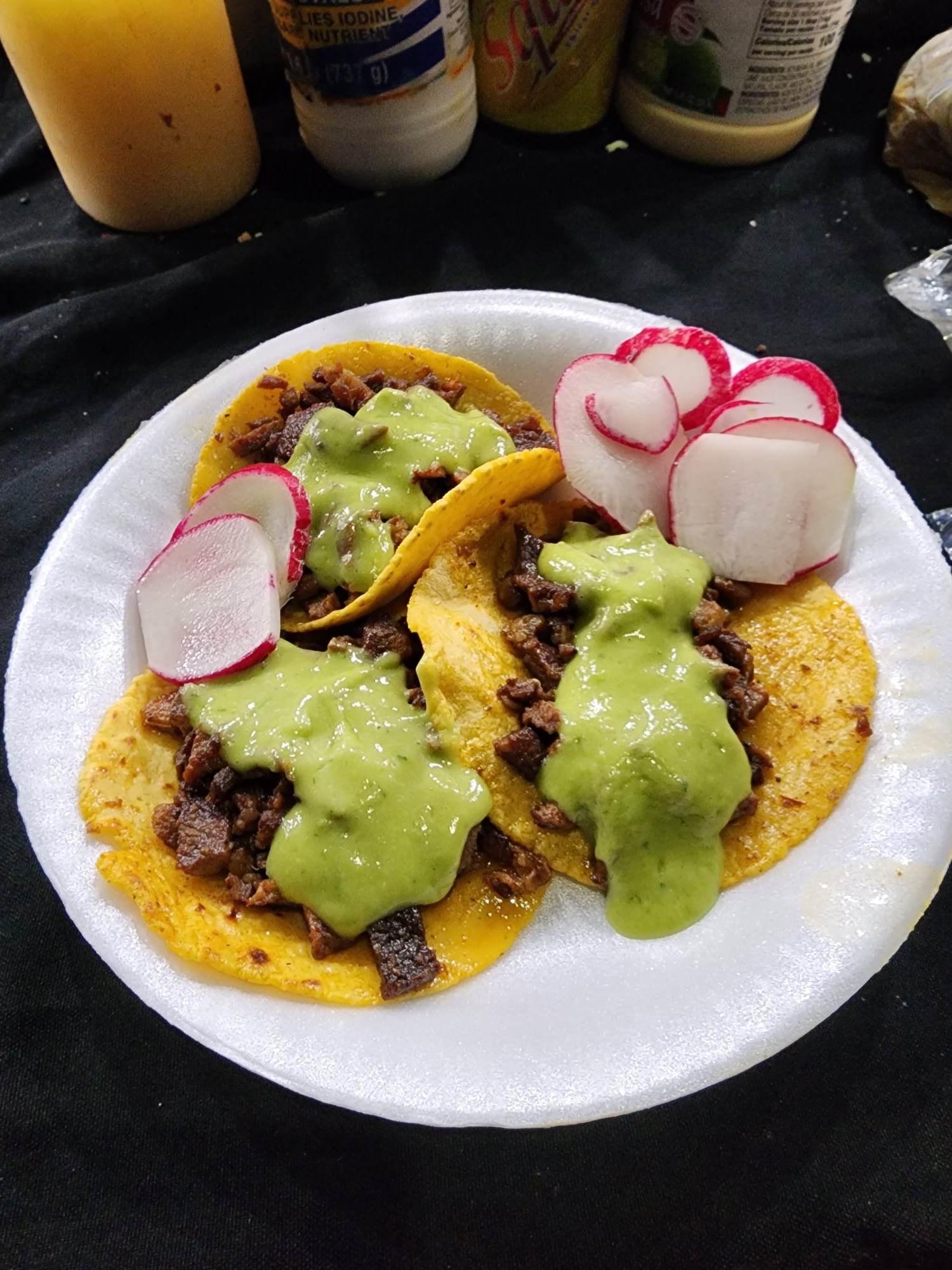 Tacos asada with salsa verde and radish